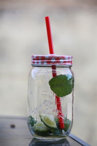 Close-up of drink in glass jar on table