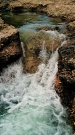 Blurred motion of rocks in sea