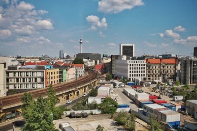 Cityscape by fernsehturm against sky