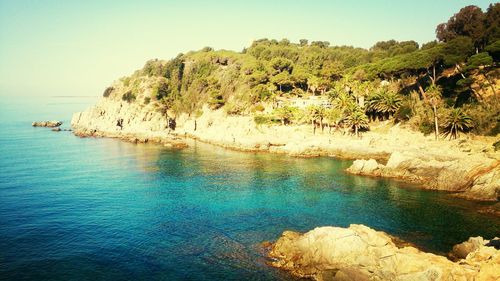 Scenic view of sea against blue sky