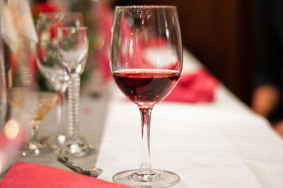 Close-up of red wine in glass on table