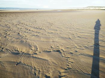 High angle view of sand on beach against sky