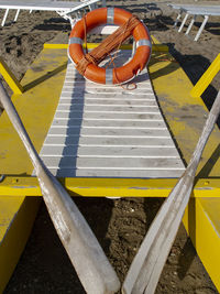 High angle view of yellow shoes hanging on playground