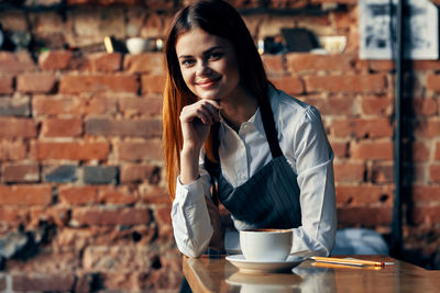 Portrait of a woman with coffee cup