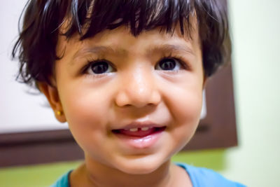 Close-up portrait of smiling boy