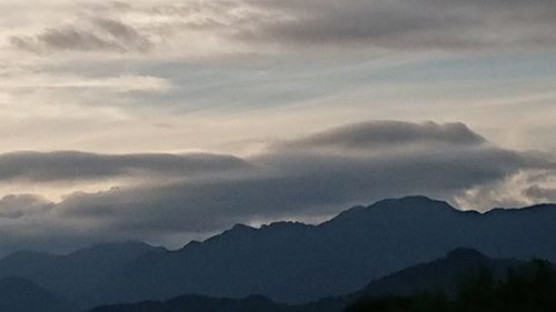 Low angle view of silhouette mountain against sky