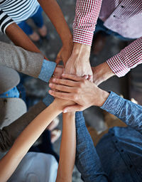 Midsection of man holding hands