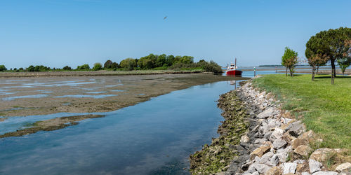 Scenic view of sea against clear blue sky