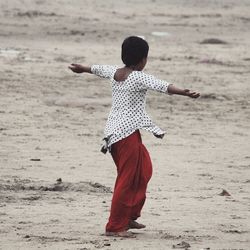 Full length of woman standing on beach