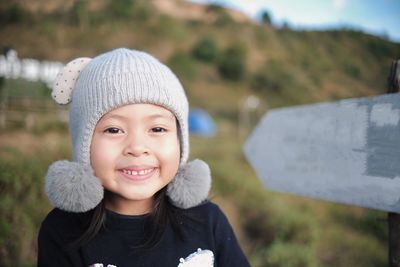 Portrait of a smiling child at top of the mountain in new normal life