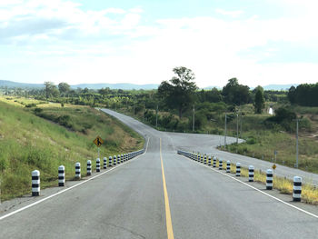 Empty road along landscape