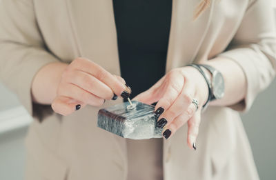 Midsection of woman holding gift box