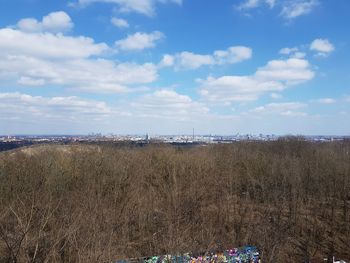 Panoramic view of field against sky