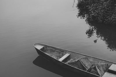 High angle view of boat moored in lake against sky