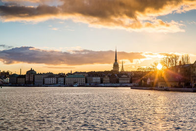 German church in town by riddarfjarden during sunset