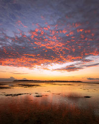 Scenic view of sea against romantic sky at sunset
