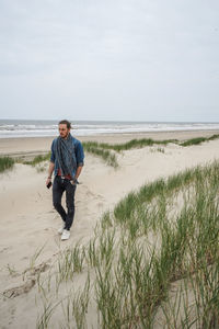 A men walking alone on the beach