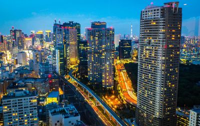 Aerial view of city lit up at night