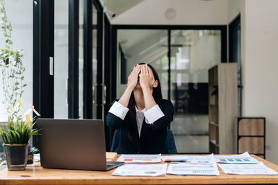 Young businesswoman working in office