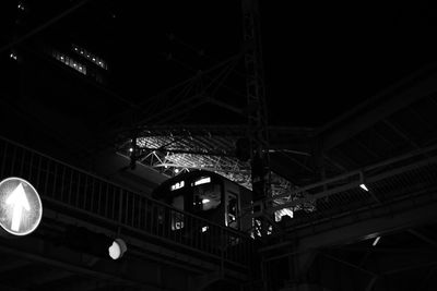 Low angle view of illuminated lights hanging from ceiling