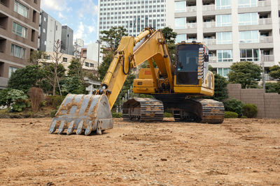 Construction site by road in city