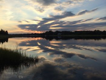 Scenic view of lake at sunset