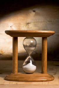 Close-up of clock on table at home