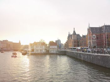 River in city against clear sky