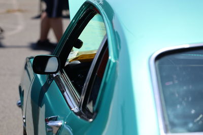 Reflection of car on side-view mirror