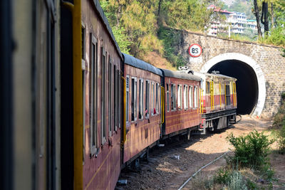 Toy train moving on mountain slopes, beautiful view, one side mountain, one side valley moving