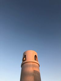 Low angle view of tower against clear blue sky