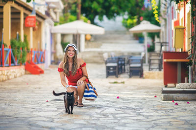 Portrait of young woman with dog