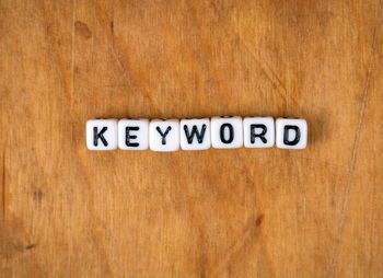Close-up of information sign on wooden table
