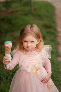 Portrait of smiling girl standing outdoors