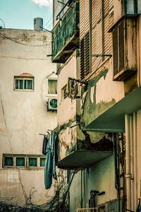 Low angle view of clothes drying outside building