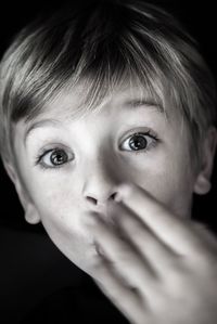 Close-up portrait of shocked boy