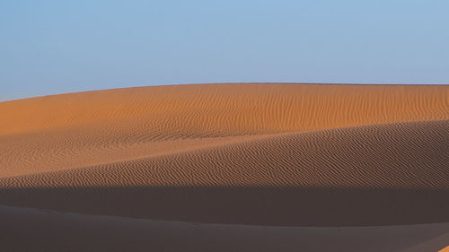 Scenic view of desert against clear sky