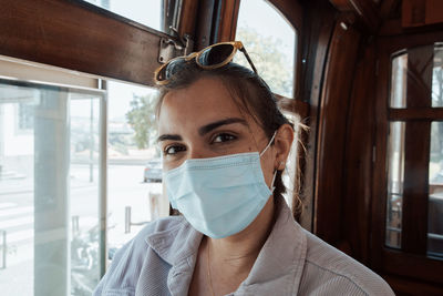 Portrait of young woman in car