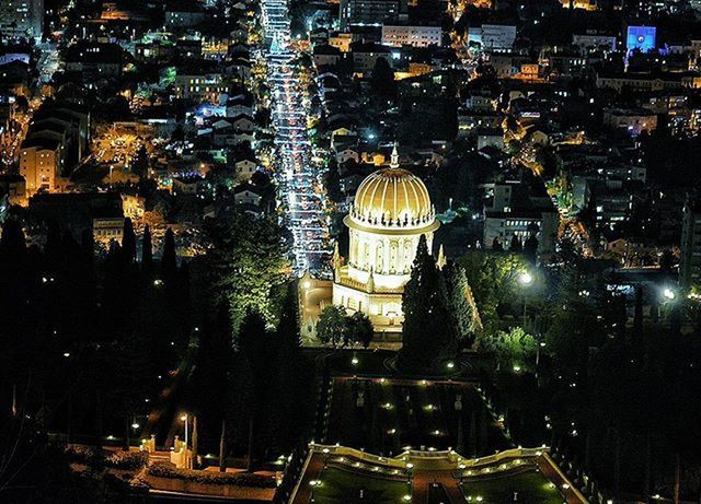 building exterior, illuminated, architecture, built structure, night, city, street, cityscape, city street, city life, high angle view, capital cities, car, road, travel destinations, famous place, travel, transportation, lighting equipment, land vehicle