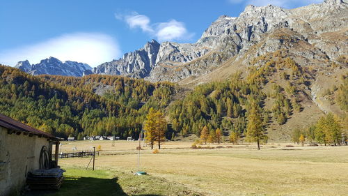 Scenic view of landscape and mountains against sky