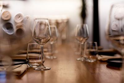 Luxury table settings for fine dining with and glassware, pouring wine to glass.