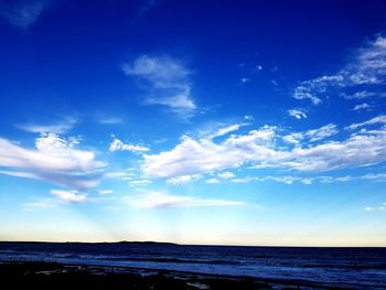 Scenic view of sea against blue sky