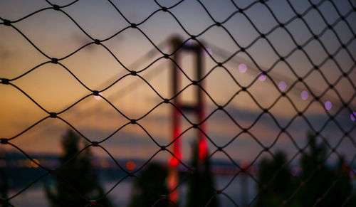 Bosporus bridge at evening, democracy and national unity day turkey, close-up of chainlink fence