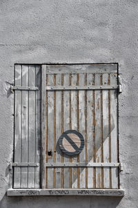 Close-up of metal grate against building