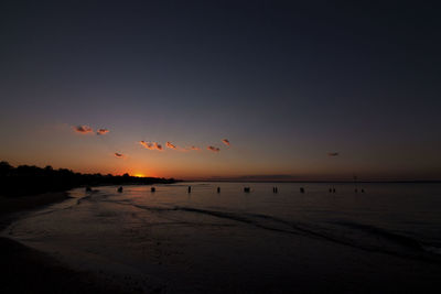 Scenic view of beach against sky during sunset