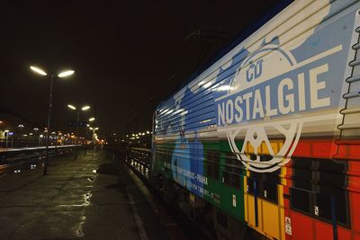 Illuminated tunnel at night