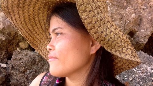 Portrait of beautiful young woman looking away