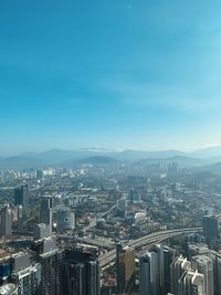 High angle view of buildings in city against sky