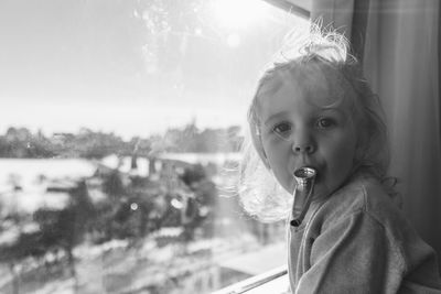 Young woman blowing bubbles