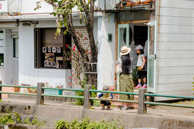 People on window of building